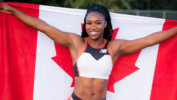 Khamica Bingham holding the Canadian flag extended behind her back wearing track clothing