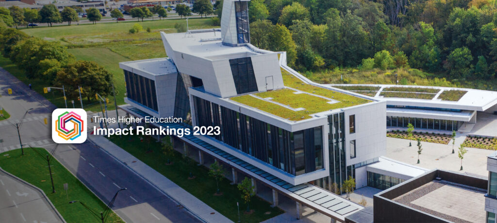 aerial image of the McEwen building at York University sorrounded by greenery. The THE Rankings logo is on the middle left of the image with THE Ranking 2023 text
